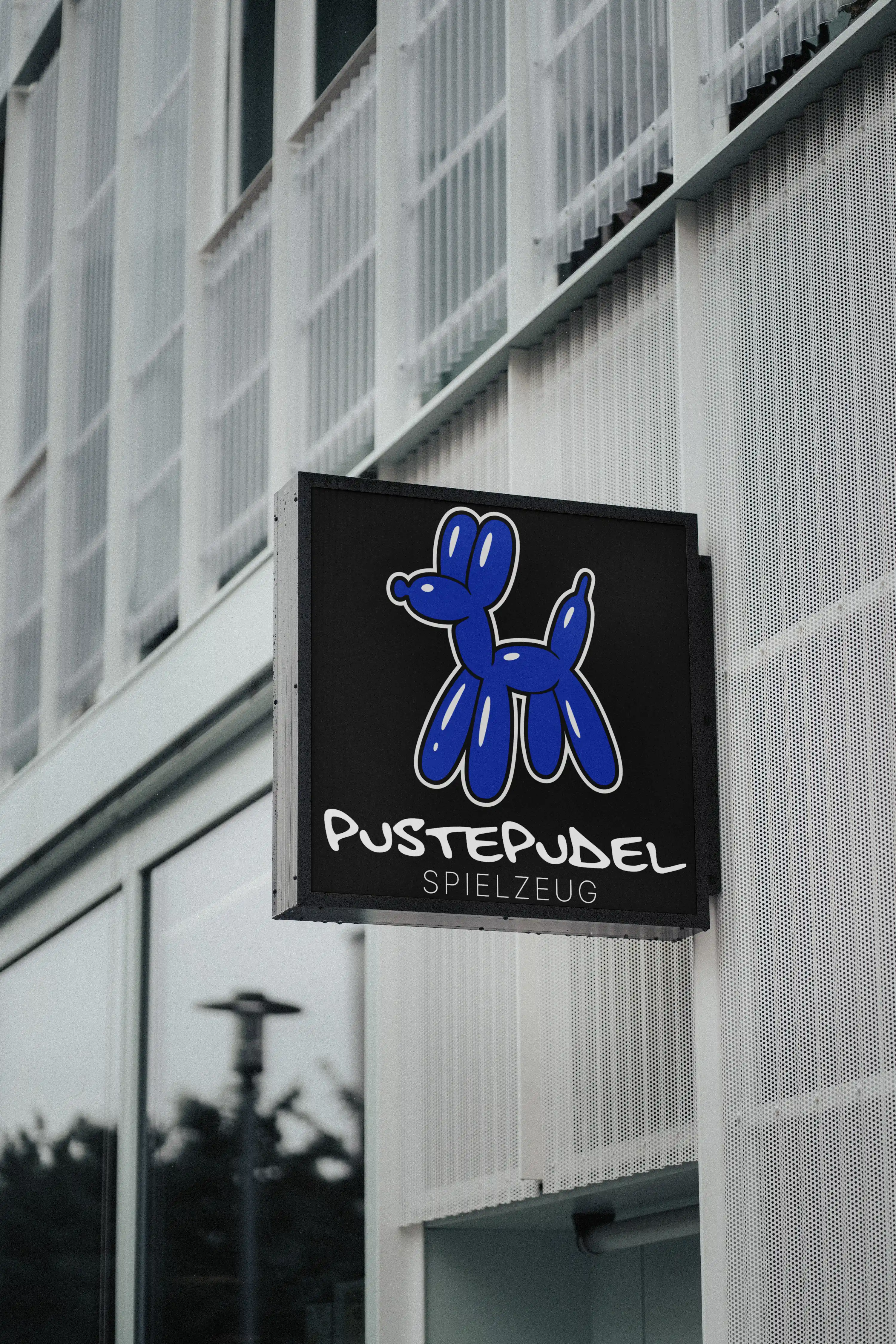 Pustepudel toy store — playful signage mockup