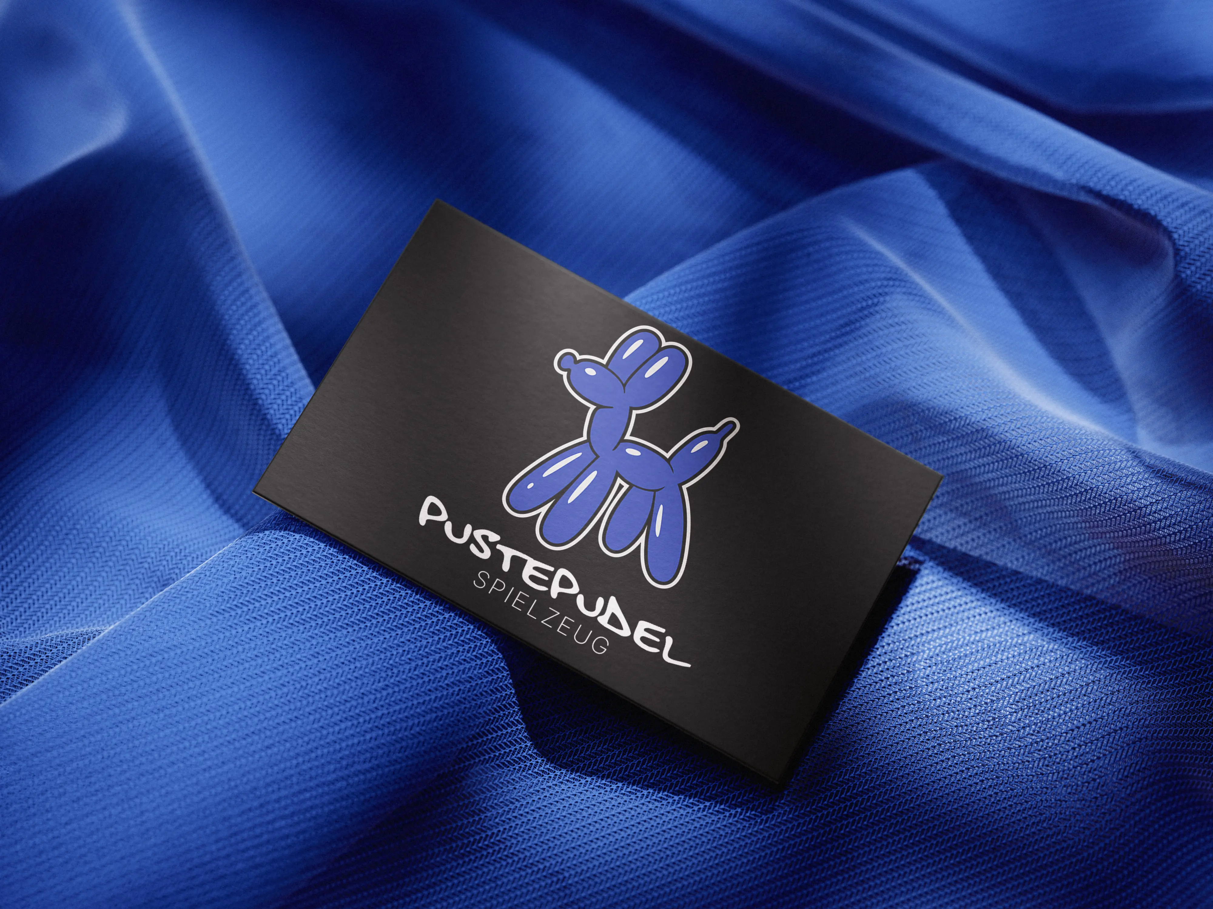 Pustepudel identity — hand-drawn typography in vibrant blue